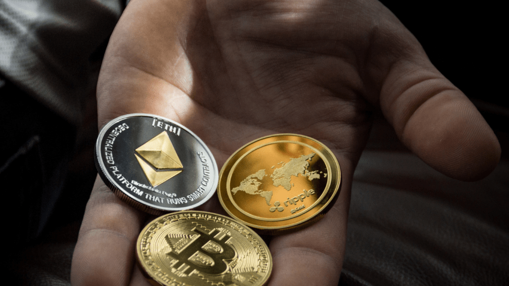 crypto coins placed in a man's hand