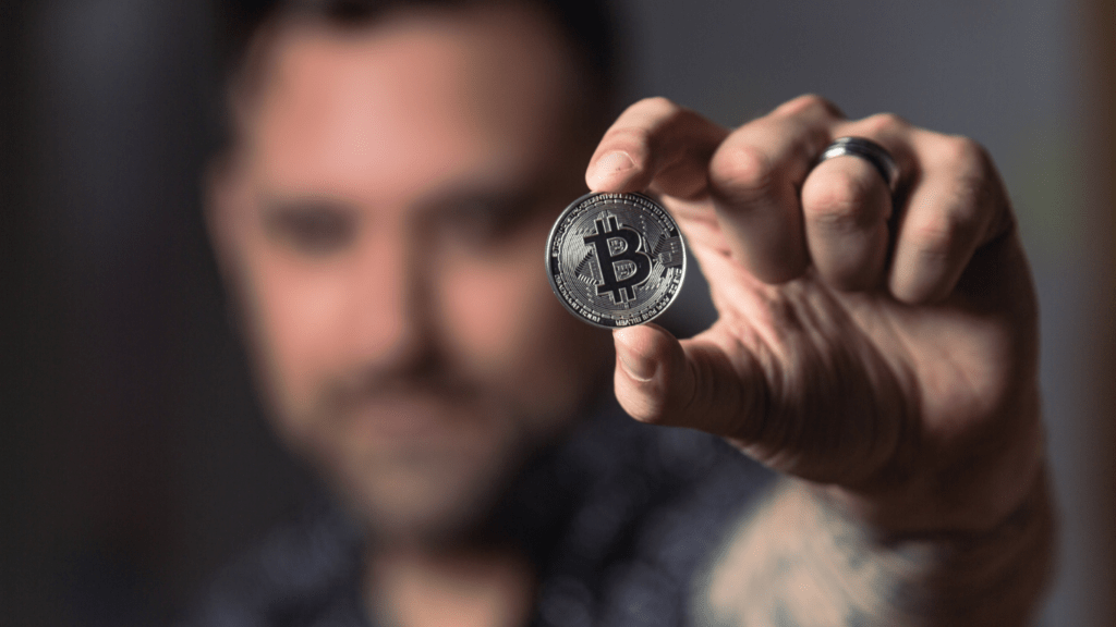 a man holding a crypto currency