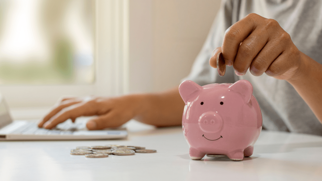 a man investing money in a mini bank