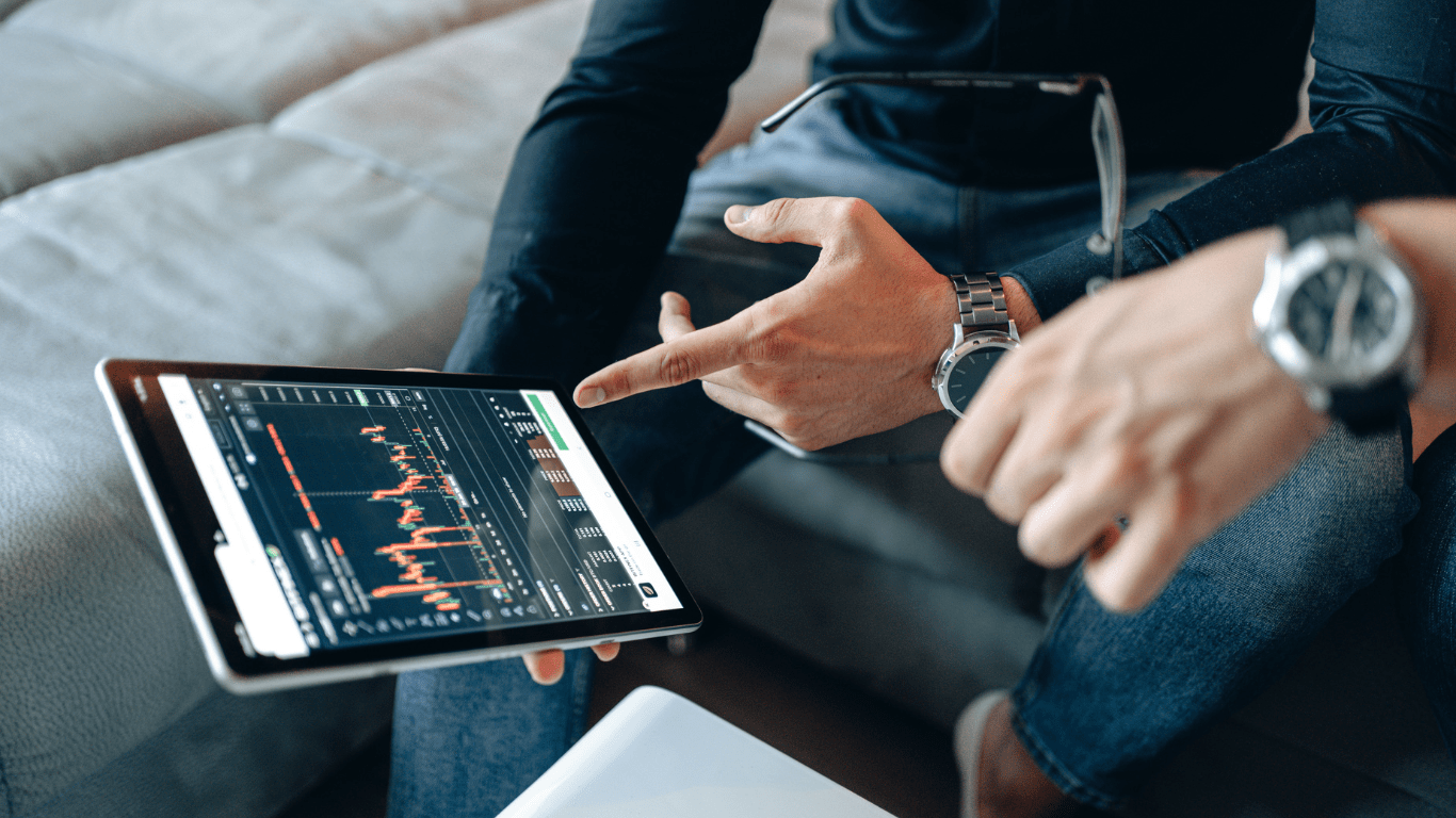 man showing trading chart of cryptocurrency